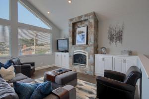 a living room with a couch and a fireplace at 5398 Nottingham in Cambria
