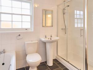 a bathroom with a toilet and a sink and a shower at Host & Stay - New Street in Canterbury