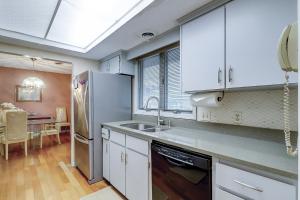 a kitchen with a sink and a refrigerator at 62 Port Tack, Hilton Head Island, SC, 29928 in Hilton Head Island