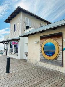 a building with a large window on the side of it at Deerfield Beach - Paradise in Deerfield Beach