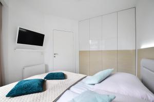 Posteľ alebo postele v izbe v ubytovaní Apartament Horyzont 101