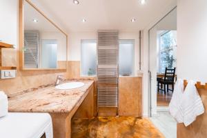 a bathroom with a sink and a mirror at LuxAvocadoLoft DUOMO 10m in Milan