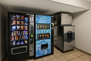 a soda vending machine next to a drink refrigerator at Red Roof Inn Cleveland - Independence in Independence
