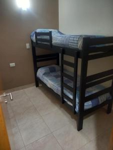 a couple of bunk beds in a room at ALOJAMIENTO NORTE SGO in Santiago del Estero