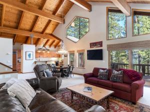 a living room with couches and a table at Tahoe Pines, enjoy the outdoors this home has to offers in Incline Village