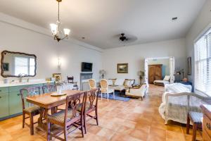a dining room and living room with a table and chairs at New Market Apartment 6 Mi to Shenandoah Caverns! in New Market