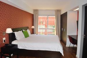 Postel nebo postele na pokoji v ubytování Hotel BA Abasto