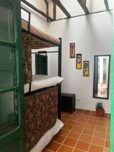 a room with two bunk beds on the wall at CASA DE LOURDES - LA CANDELARIA in Bogotá