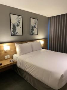 Postel nebo postele na pokoji v ubytování B's Suites Mérida