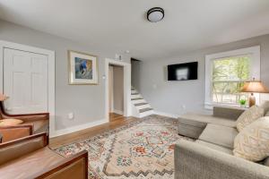 a living room with a couch and a window at Stunning Charlotte Retreat about 2 Mi to City Center! in Charlotte