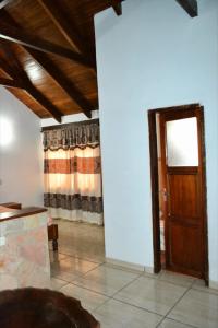 a living room with a door and a window at Lago Manantial in Independencia