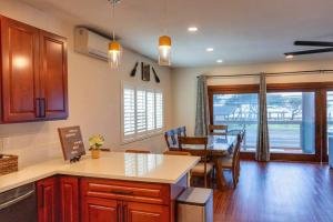 a kitchen and dining room with a table and a dining room at Oceanfront Family Retreat - Views, Wi-fi & A/C in Kaaawa