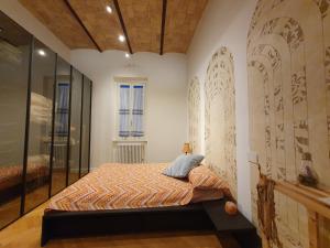 a bedroom with a bed and a glass wall at Casa Menna in Rome