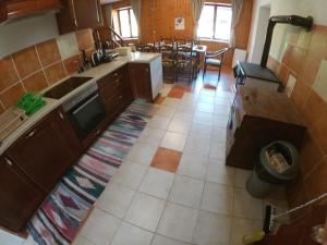 an aerial view of a kitchen and dining room at Family friendly house with a parking space Brestova Draga, Gorski kotar - 21977 in Delnice +14 photos