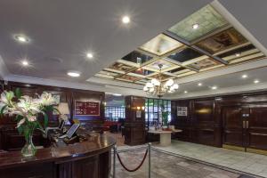 a large lobby with a reception desk and a ceiling at Hampstead Britannia in London