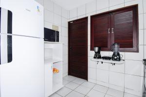 Η κουζίνα ή μικρή κουζίνα στο casa pé na areia, ao lado do caminho de moises