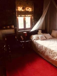 a bedroom with a bed with a teddy bear on it at πετρινο σαλε in Palaios Agios Athanasios +6 photos