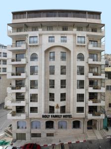 a building with a hoy family hotel on it at Holy Family Hotel in Bethlehem