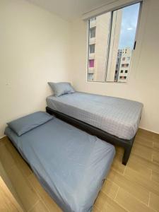 Postel nebo postele na pokoji v ubytování Hermoso apartamento nuevo en Barranquilla