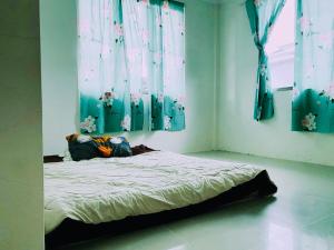 Ein Bett oder Betten in einem Zimmer der Unterkunft JY Coliving, Luak