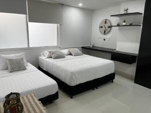Voodi või voodid majutusasutuse Aparta hotel Le Soleil toas
