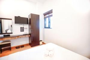 Postel nebo postele na pokoji v ubytování TTR Midtown View Hotel