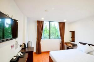 Postel nebo postele na pokoji v ubytování TTR Midtown View Hotel