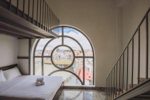 Postel nebo postele na pokoji v ubytování TTR Midtown View Hotel