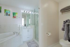 a white bathroom with a shower and a toilet at Greenlinks at Lely Luxury Purple Orchid Fully Renovated Modern 1st floor 3bdr Golf Resort Villa in Naples