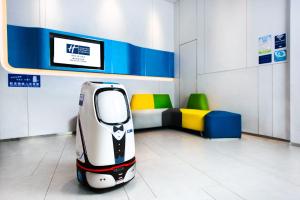 a small car parked in a room with a couch at Holiday Inn Express Macau City Centre, an IHG Hotel in Macau