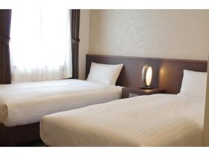 Postel nebo postele na pokoji v ubytování Bande Hotel Osaka + 37 fotografií