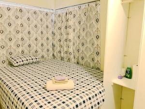 a small bedroom with a bed with a black and white checkered at New bedroom queen size bed at Las Vegas for rent-4 in Las Vegas