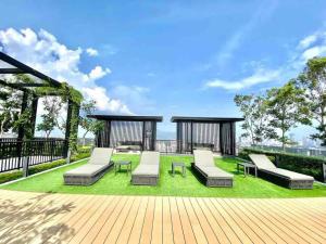 a patio with lounge chairs and a gazebo at Beacon Executive Suite by Uptrend Home Management in George Town