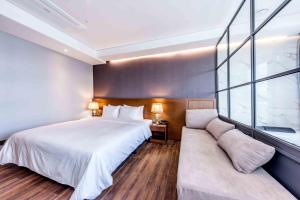 Postel nebo postele na pokoji v ubytování Dyne Oceano Hotel