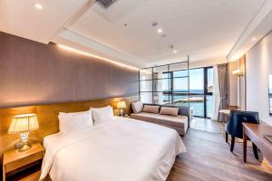 Postel nebo postele na pokoji v ubytování Dyne Oceano Hotel