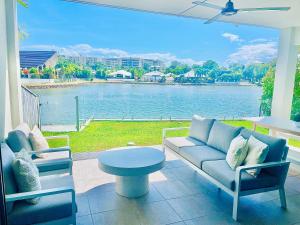 a living room with a view of the water at Blue Lagoon Villa B in Cairns