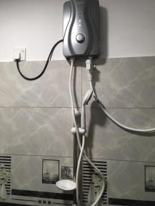 a hair dryer is attached to a wall at Sky Family Villa Ahangama in Ahangama