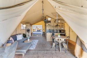 a living room and kitchen in a tent at BIG4 Tasman Holiday Parks - Bendigo in Bendigo