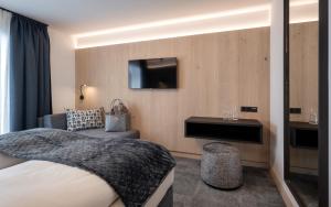 Posteľ alebo postele v izbe v ubytovaní Ski & Bike Hotel Wiesenegg