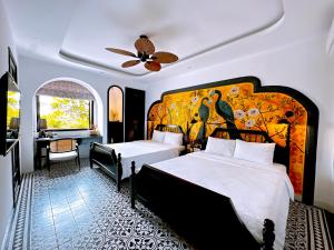 a hotel room with two beds and a bathroom at Moon Homestay in Thôn Kim Long (1) +103 photos