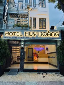 a hotel huong homes sign in front of a building at Huy Hoàng Hotel Phan Thiet in Phan Thiet