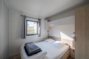 Postel nebo postele na pokoji v ubytování Camping de Saverne