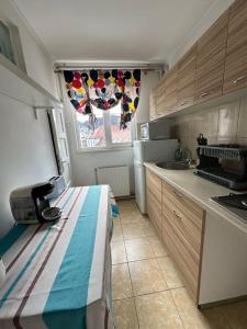 a kitchen with a table in the middle of a room at central place in Braşov