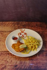 a plate of food with fried chicken and french fries at Gasthof Sauer GmbH in Straß in Steiermark