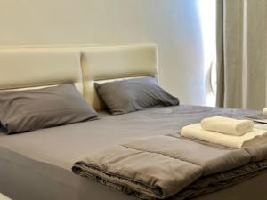 Postel nebo postele na pokoji v ubytování The Nack Resort & Pool Villa บางบัวทอง