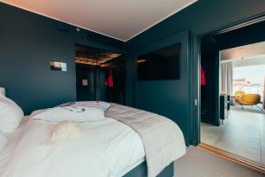 Postel nebo postele na pokoji v ubytování Hotel AX