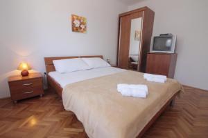 Postel nebo postele na pokoji v ubytování Studios & Rooms Fiesta