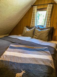 Postel nebo postele na pokoji v ubytování Chalet Wildalpen (in Ruhelage & mit Wellness)
