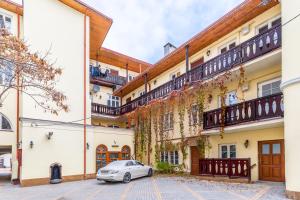 a car parked in front of a building at Amazing Apartment in the Heart of City Center - DELUX in Lublin