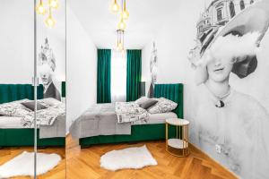 two pictures of a bedroom with a bed and a mirror at Amazing Apartment in the Heart of City Center - DELUX in Lublin